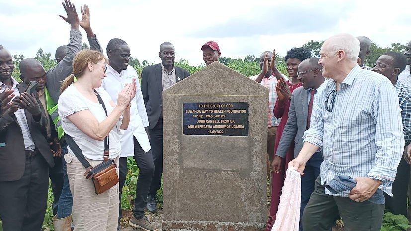 Dr. John Campbell unveils a plaque, which reads: To the glory of God, Buwanga Way to Health Foundation, stone was laid by John Campbell from UK and Wefwafwa Andrew of Uganda 16/09/2022