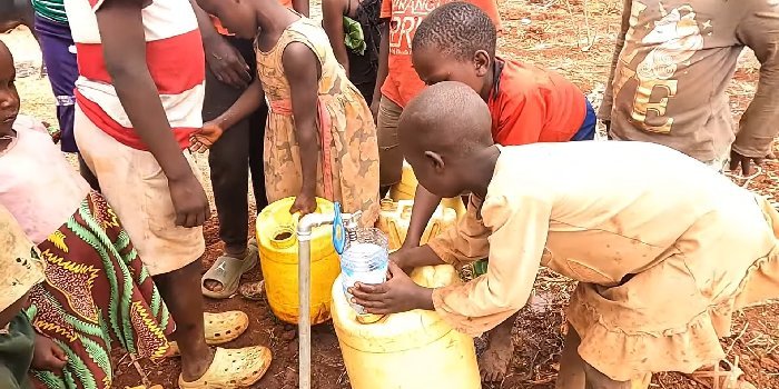 Children collecting water from the community tap